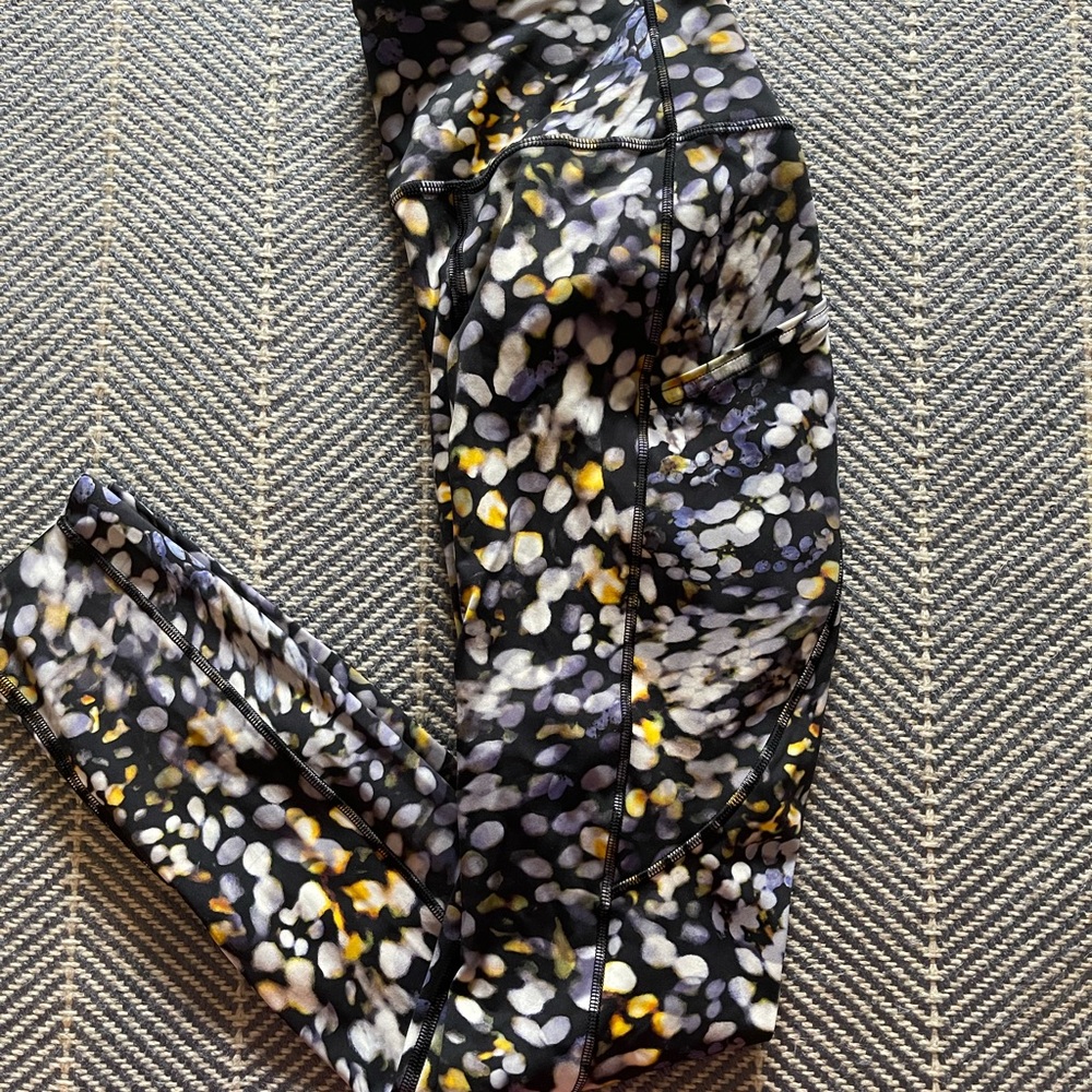 Lululemon leggings with side pockets and back pocket, size 4